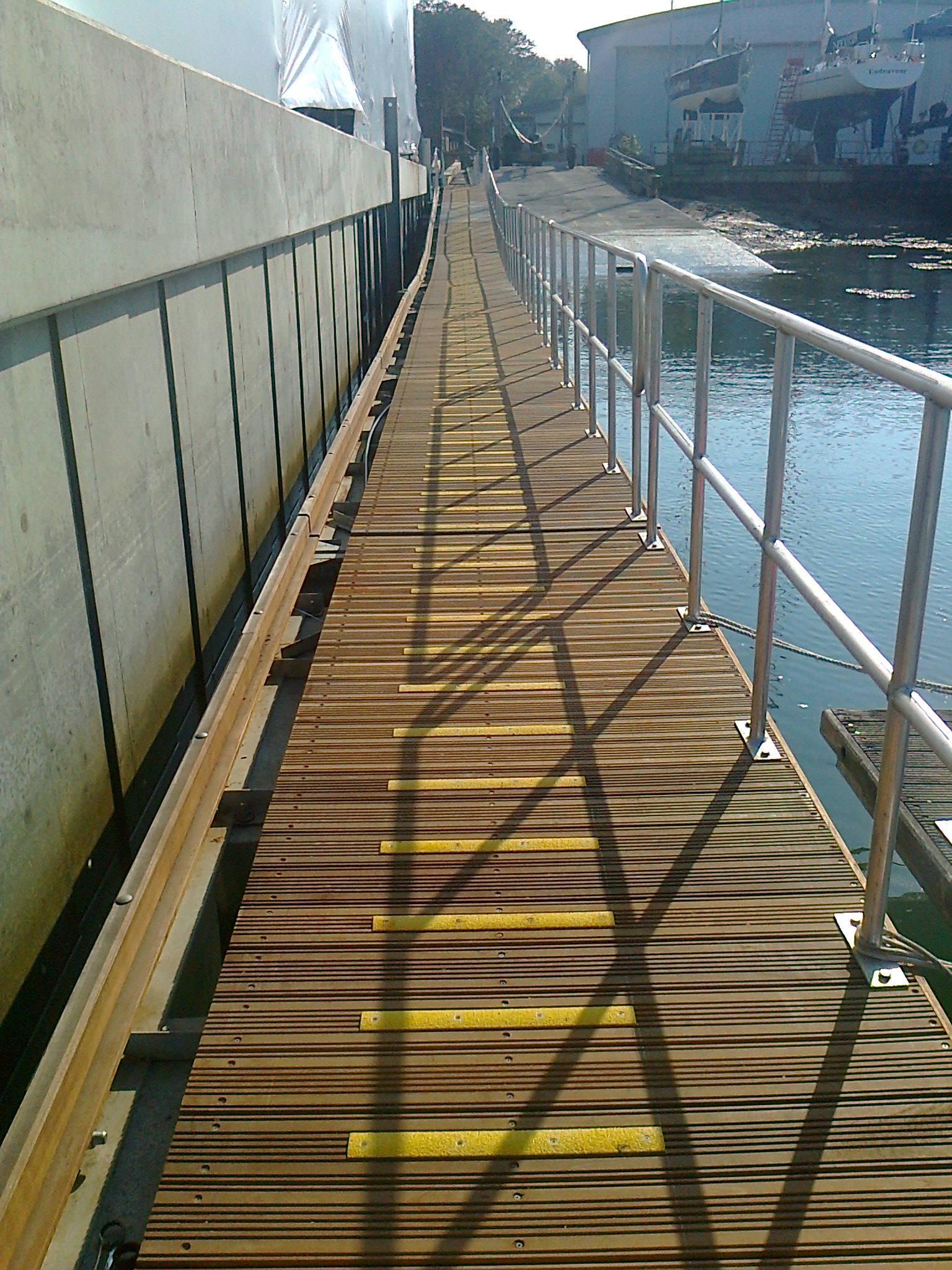Anti-slip decking strips installed along a timber waterside access walkway.
