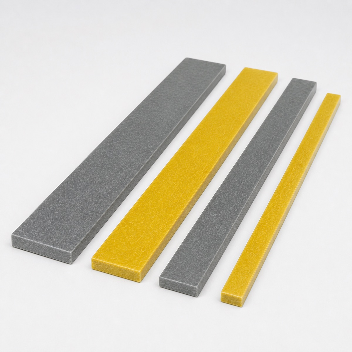 Clean studio view of pultruded GRP kick plate and toe plate profiles