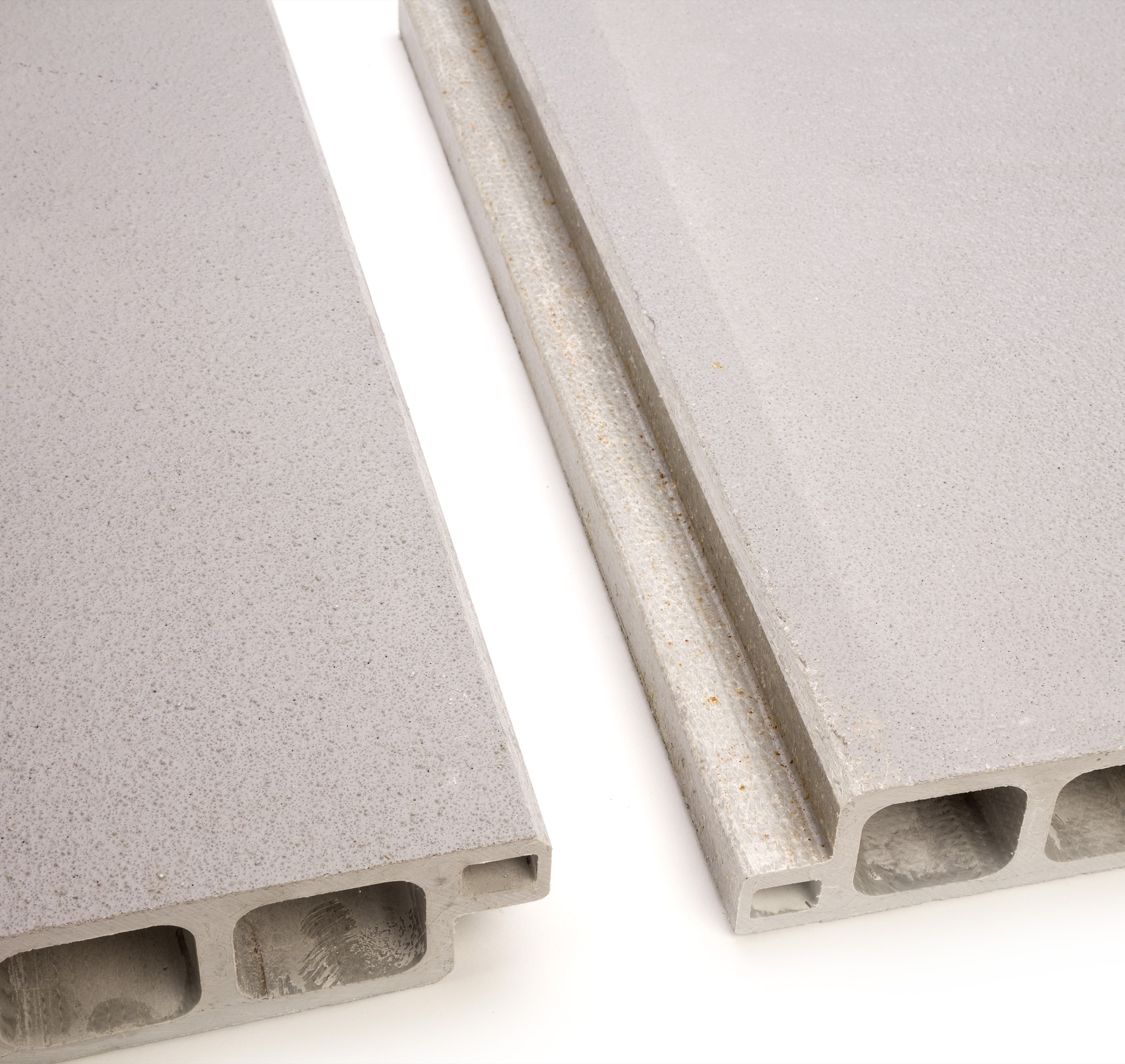 Close-up of light-grey SafeSlab pultruded GRP flooring panels showing the structural hollow sections