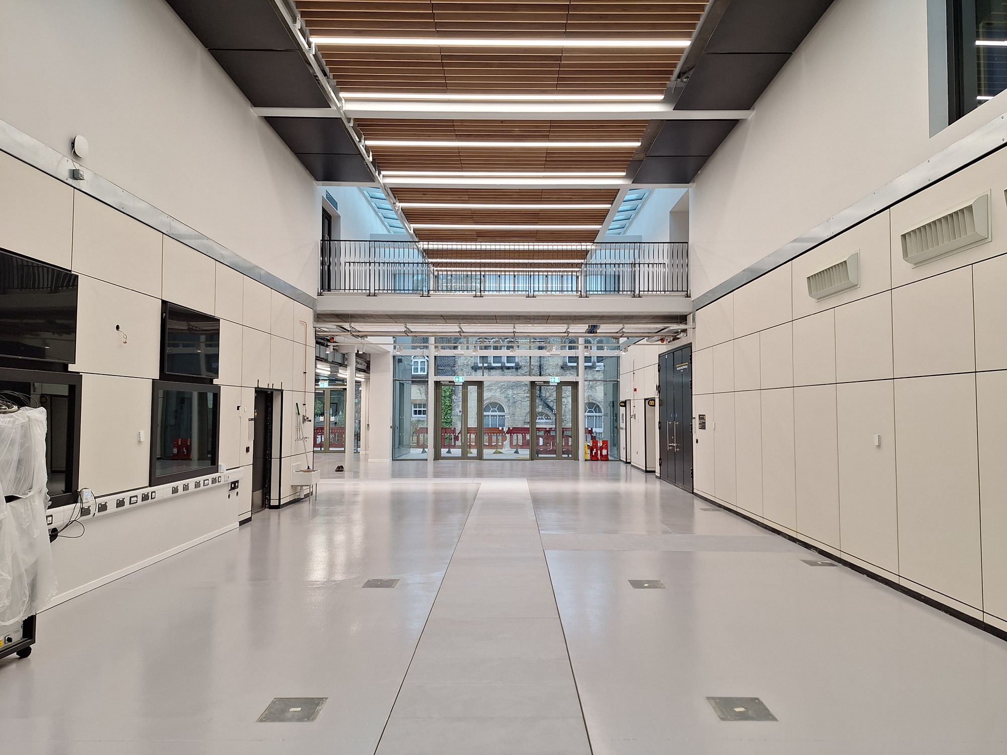 Installed light-grey solid top GRP flooring in an Oxford Brookes University interior access area
